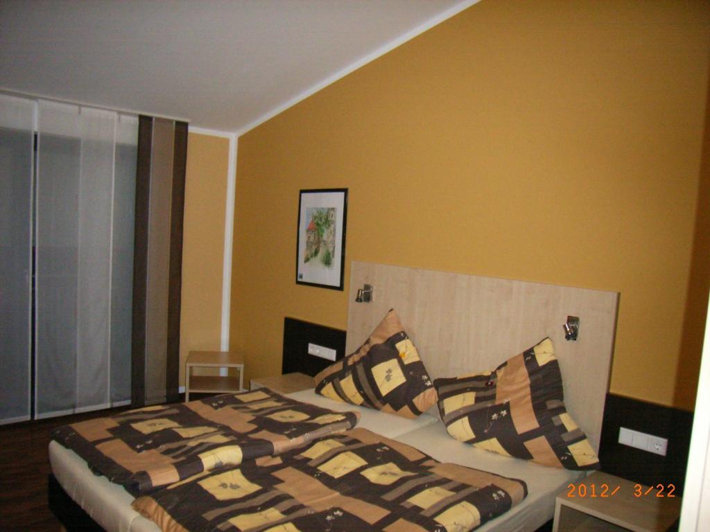 Postel nebo postele na pokoji v ubytování Auszeit Cafè & Hotel