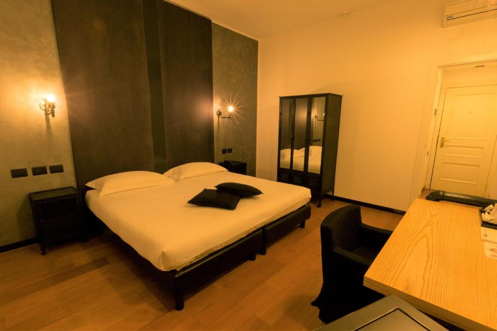 Postel nebo postele na pokoji v ubytování Hotel Miramonti