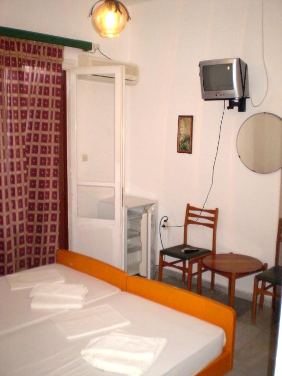 Postel nebo postele na pokoji v ubytování Hotel Maroulis
