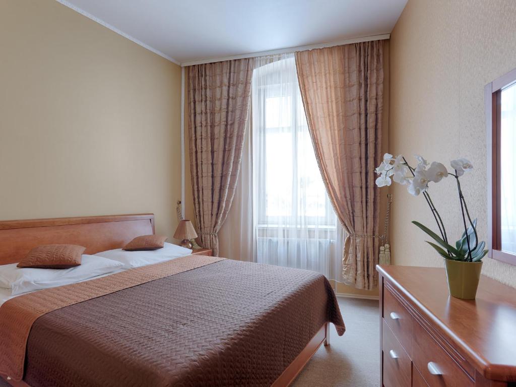Postel nebo postele na pokoji v ubytování Rezidence Sadová