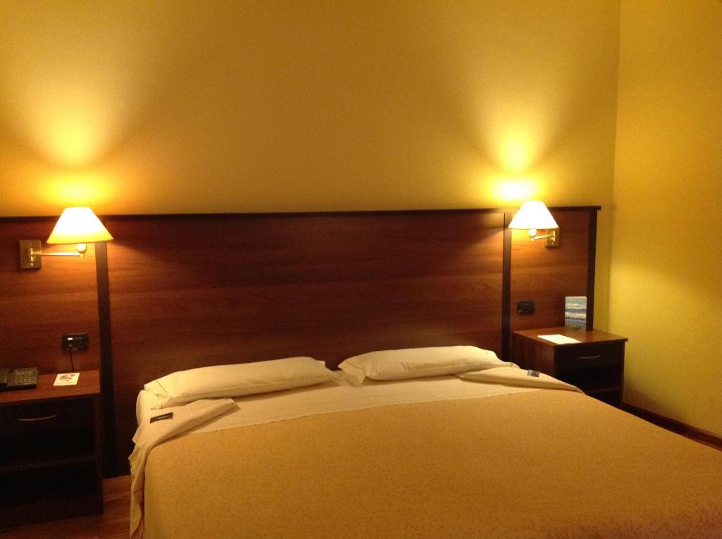 Postel nebo postele na pokoji v ubytování Hotel Bel Sit