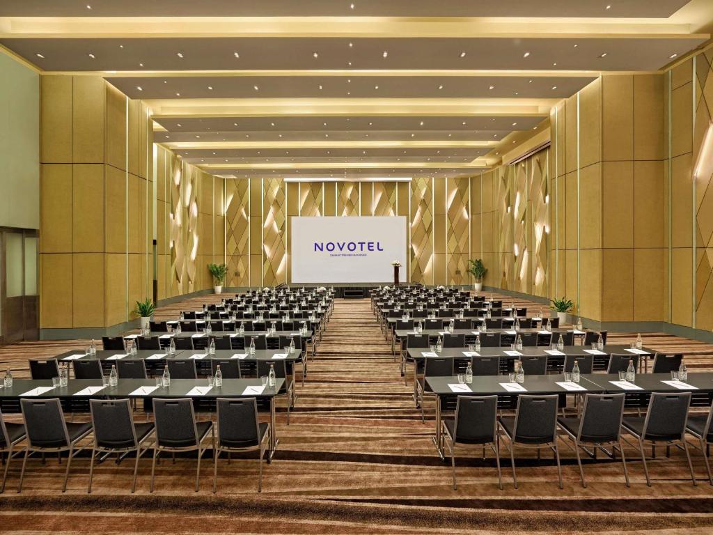 A large conference hall arranged classroom-style for presentations.