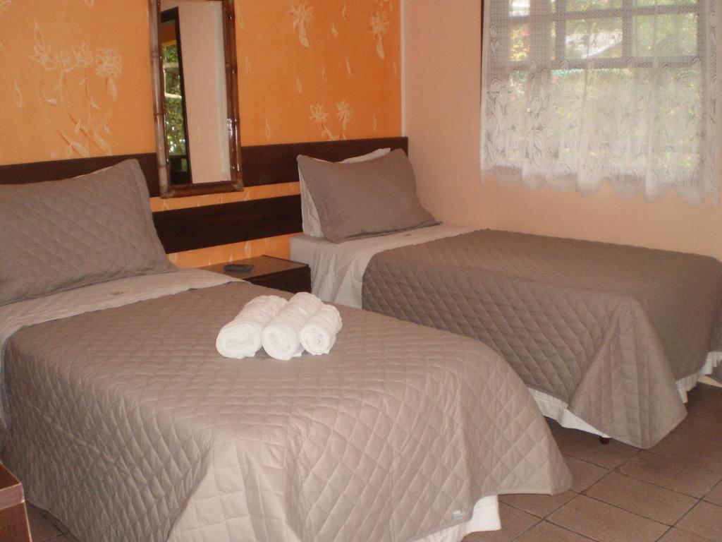 Cama ou camas em um quarto em Pousada Estrela do Mar