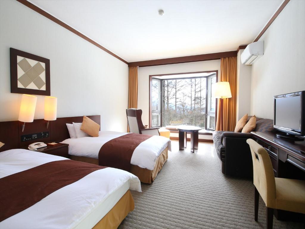 Postel nebo postele na pokoji v ubytování Tateshina Tokyu Hotel