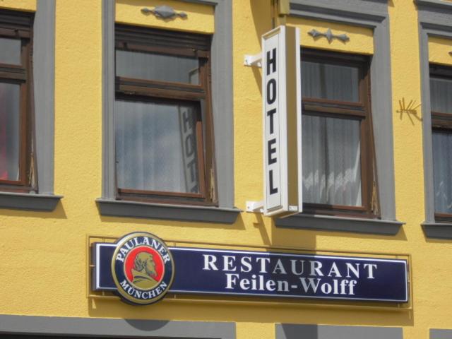 a restaurant sign on the side of a building at Hotel Feilen-Wolff in Trier