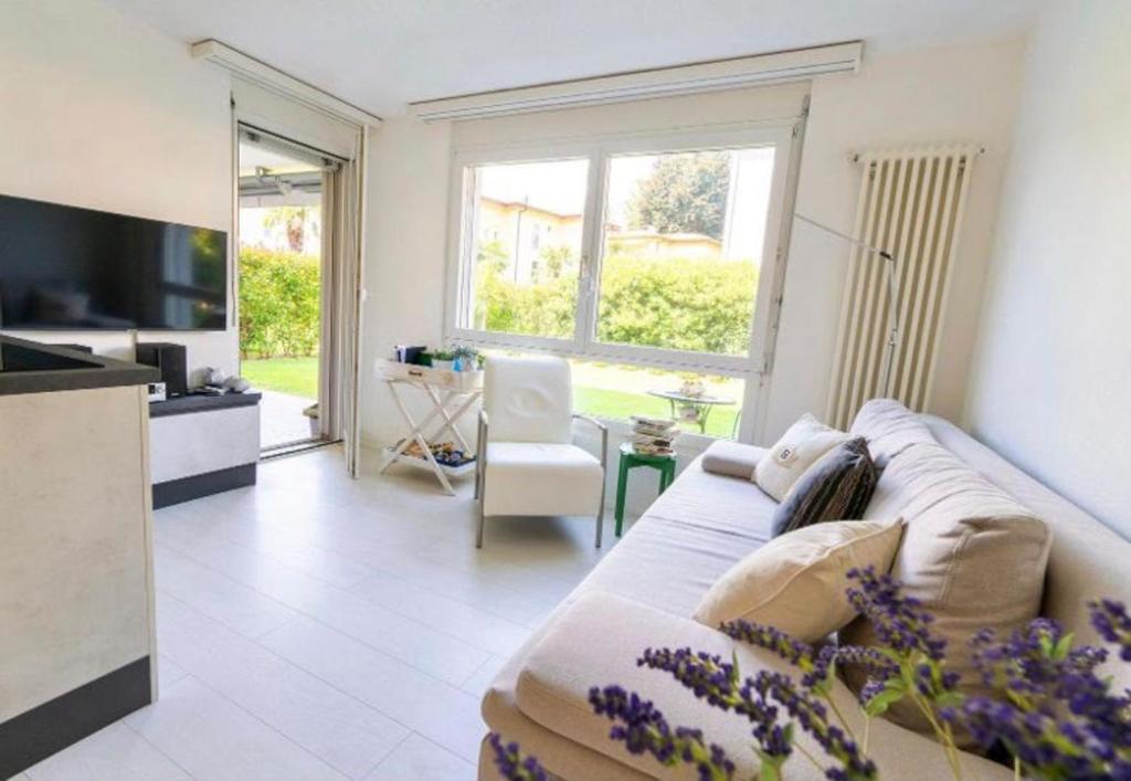 ASCONA ISOLA VERDE Familienfreundliche sonnige Ferienwohnung mit 100m2 eigenem Garten & Klimaanlage