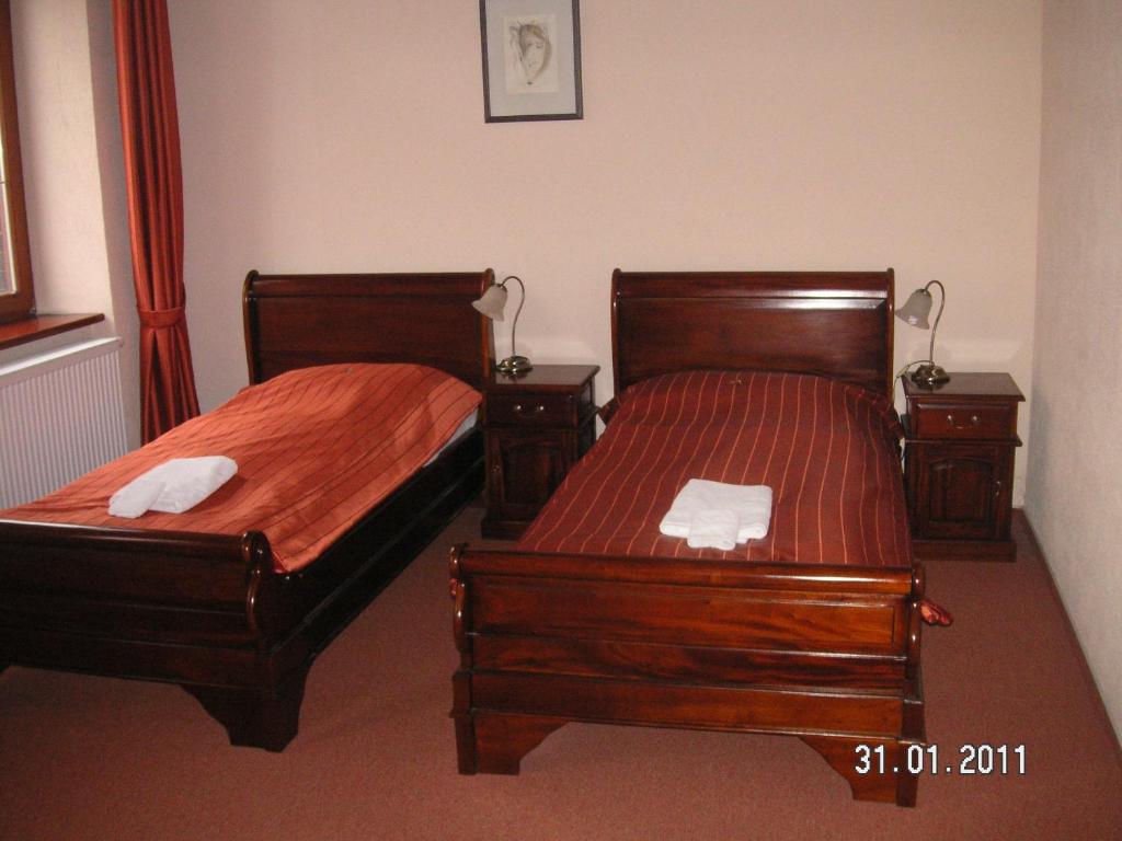 Postel nebo postele na pokoji v ubytování Hotel na Kafkové