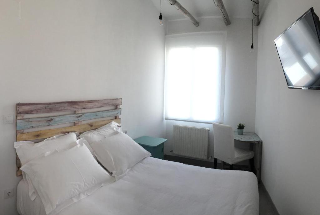 Postel nebo postele na pokoji v ubytování Hostal Gargal