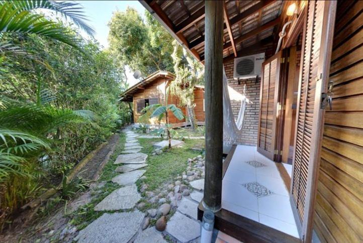 an outside view of a patio of a house at Pousadinha in Ilha do Mel