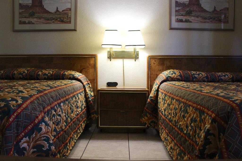 Postel nebo postele na pokoji v ubytování Starlite Motel