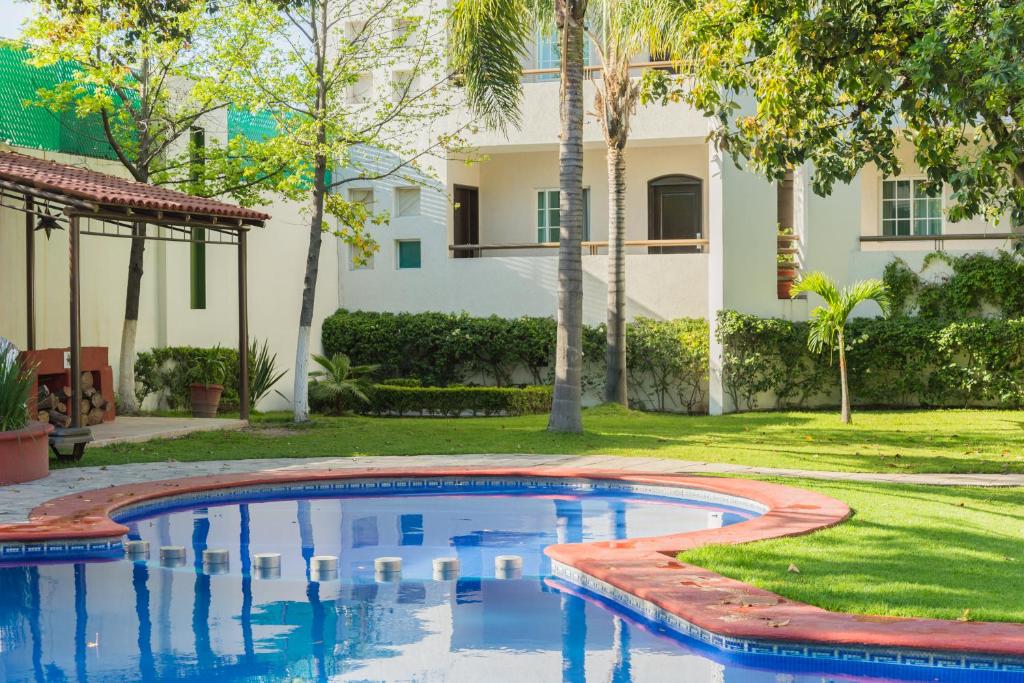 Bazén v ubytování Áurea Hotel and Suites nebo v jeho okolí