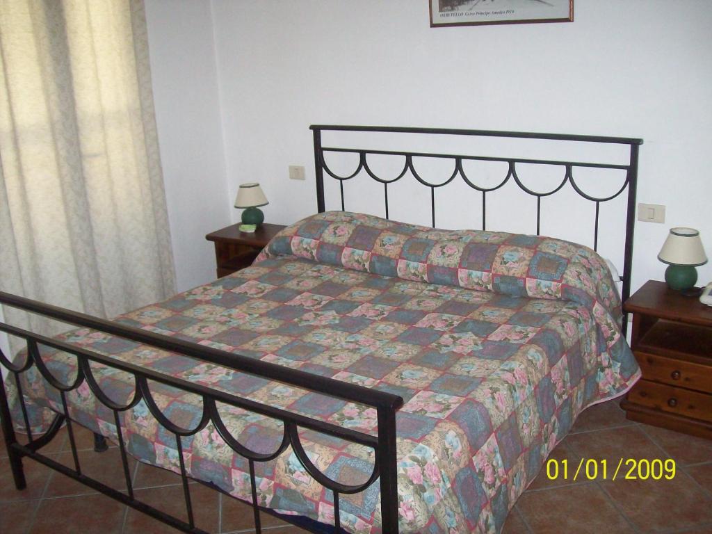 Postel nebo postele na pokoji v ubytování Albergo La Perla