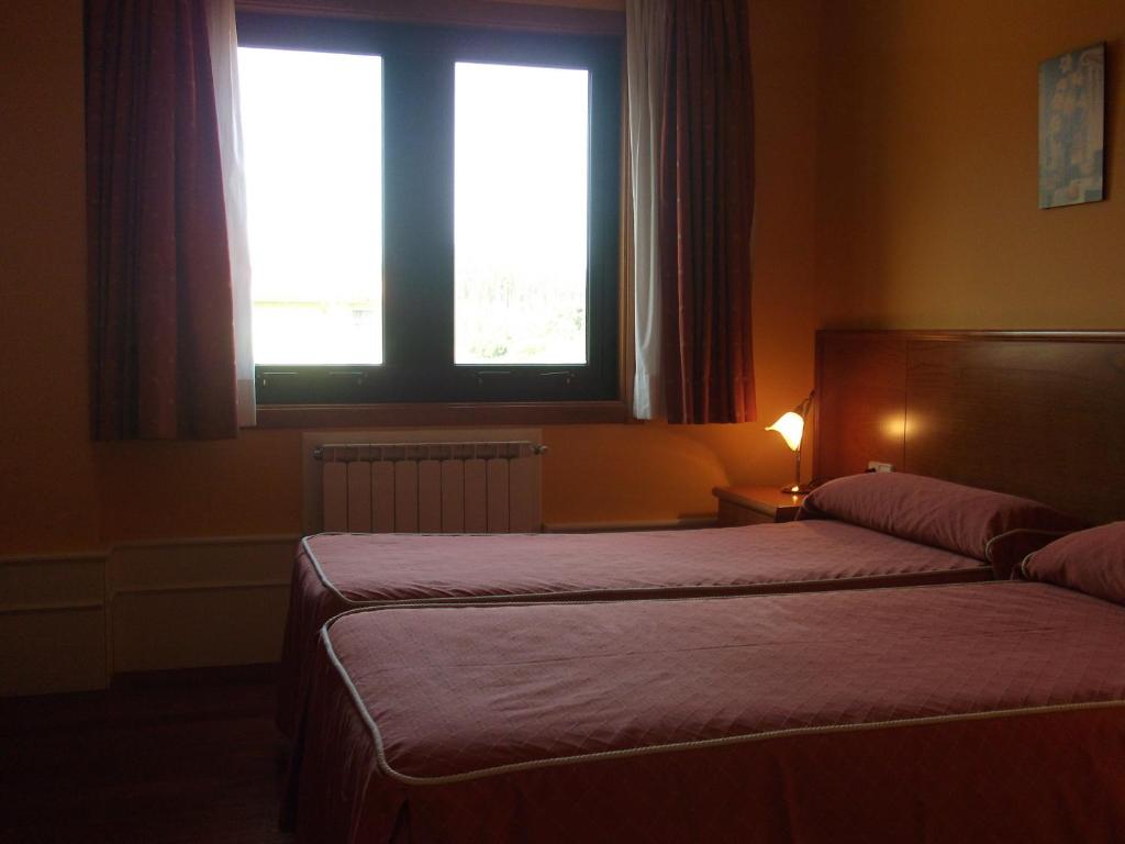 Postel nebo postele na pokoji v ubytování Val de Serantes