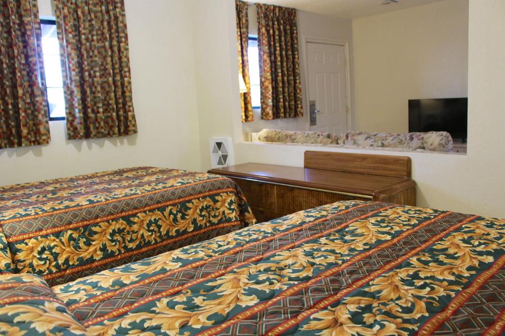 Postel nebo postele na pokoji v ubytování Starlite Motel