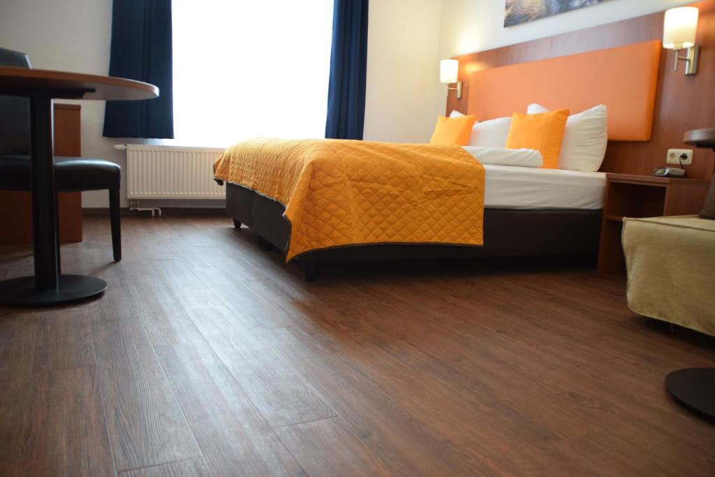 Postel nebo postele na pokoji v ubytování Hotel Amber Altstadt