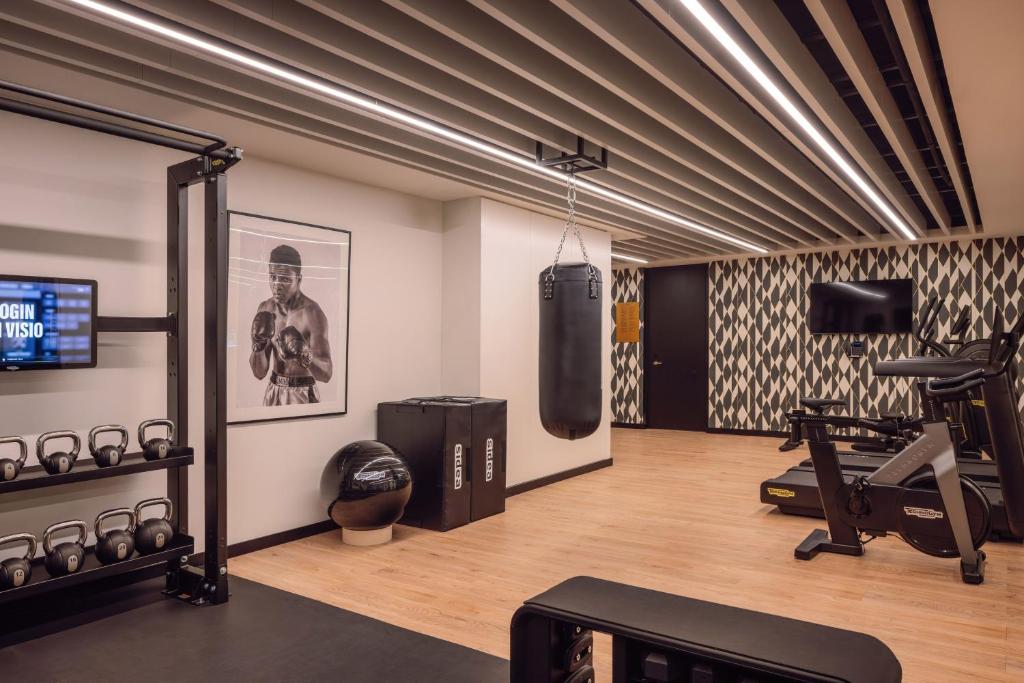 A functional-training area includes a punching bag, kettlebells and cardio equipment.