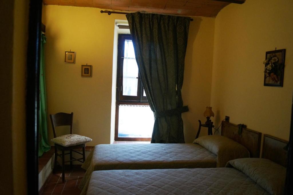 A bed or beds in a room at Agriturismo Bonzalone