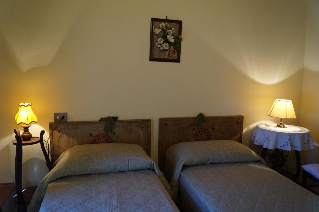 A bed or beds in a room at Agriturismo Bonzalone
