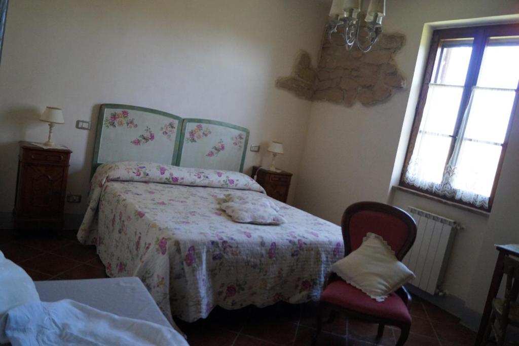 A bed or beds in a room at Agriturismo Bonzalone