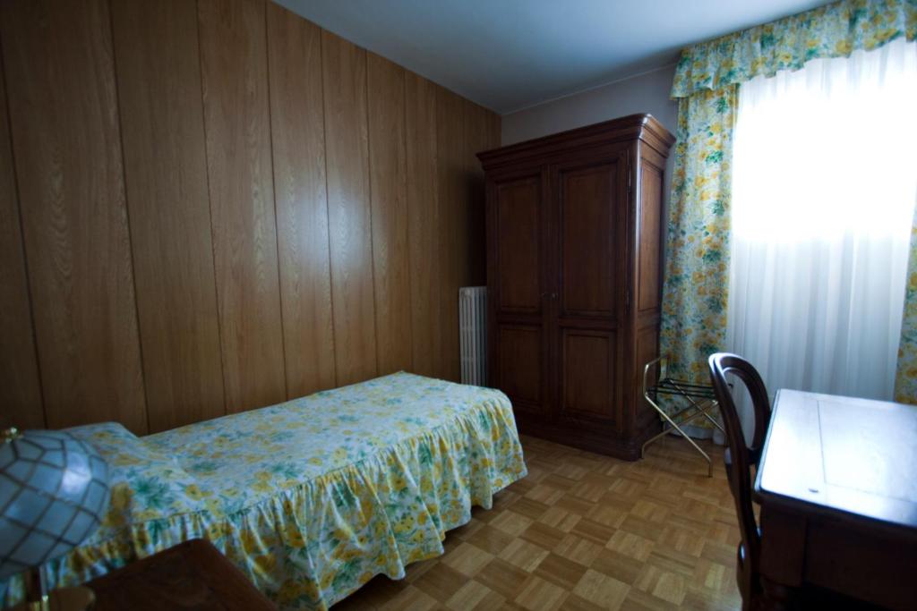 Кровать или кровати в номере Hotel Panoramique
