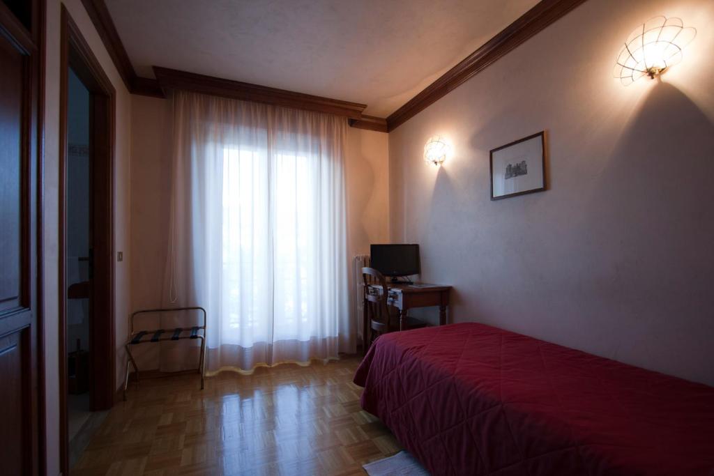 Кровать или кровати в номере Hotel Panoramique