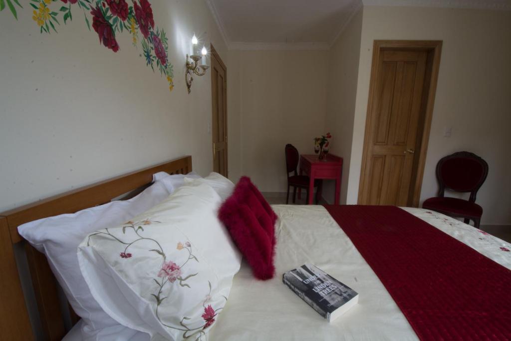Postel nebo postele na pokoji v ubytování Taboga Palace SPA Hotel