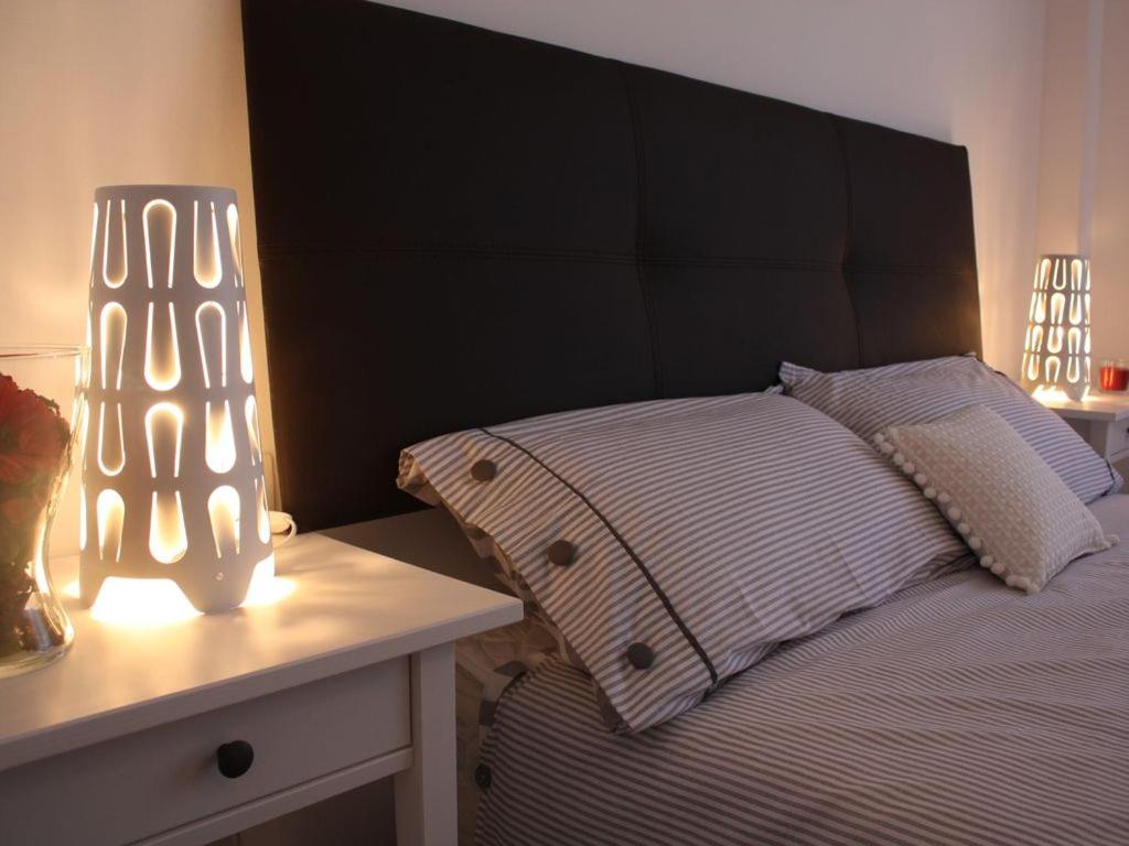 Posteľ alebo postele v izbe v ubytovaní Apartamento moderno cerca del centro