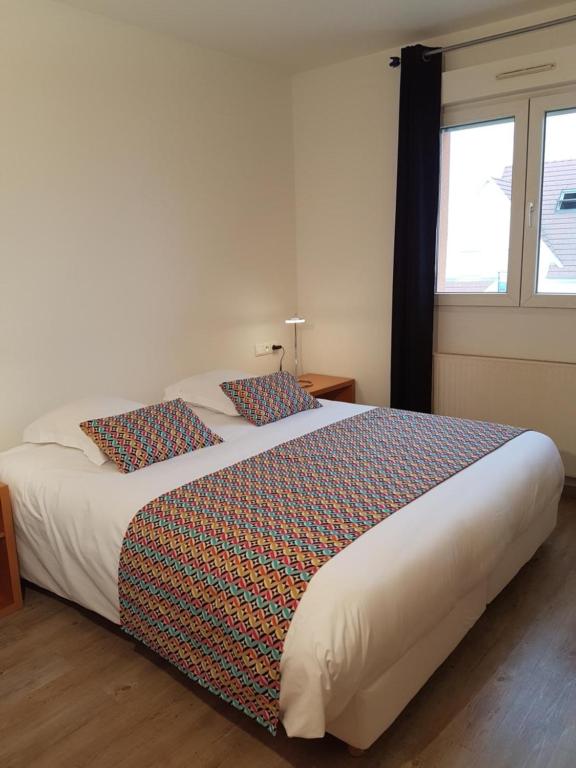 Postel nebo postele na pokoji v ubytování Hôtel Des Bois
