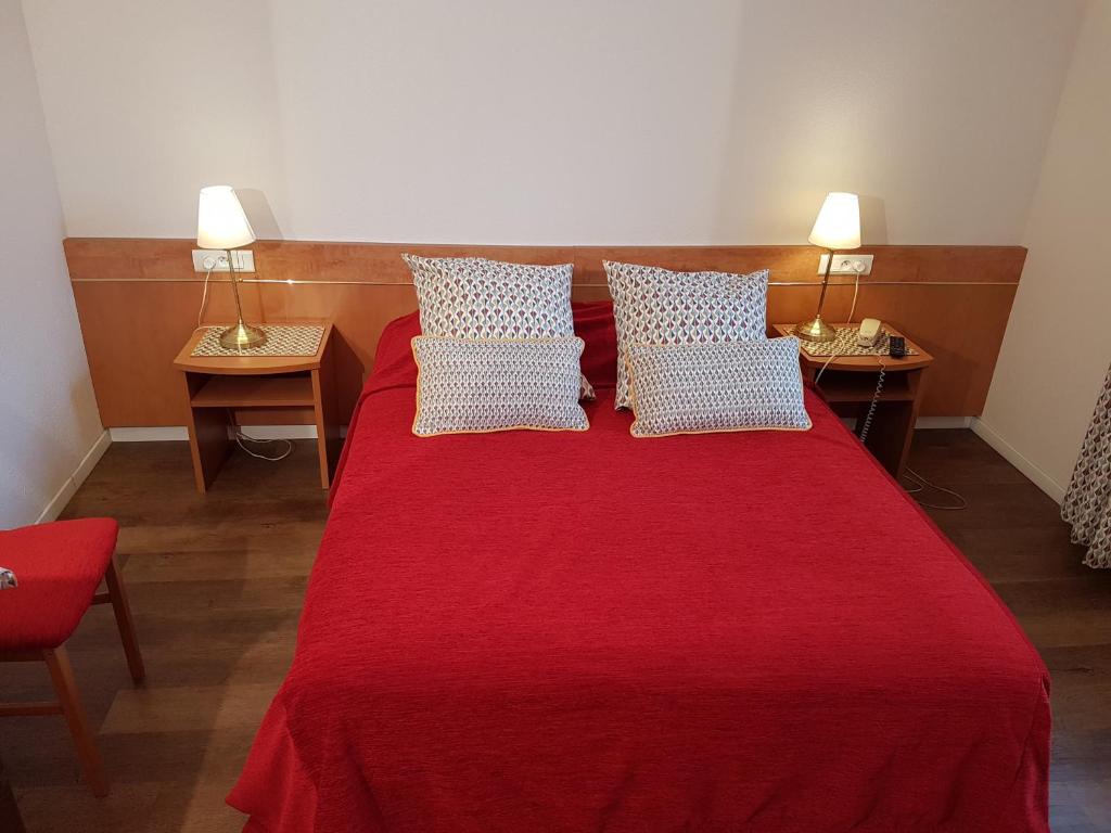 Postel nebo postele na pokoji v ubytování Hôtel Des Bois