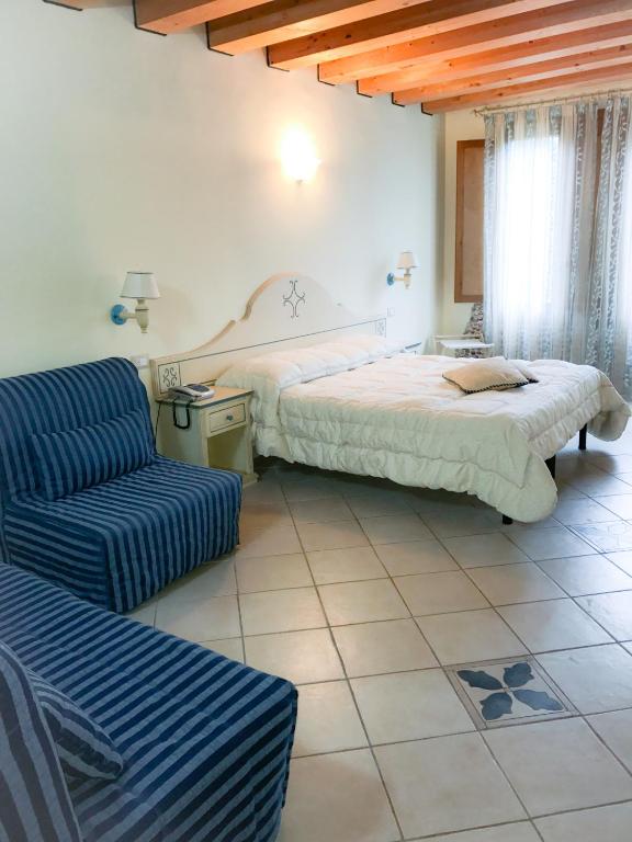 Postel nebo postele na pokoji v ubytování Hotel La Nave