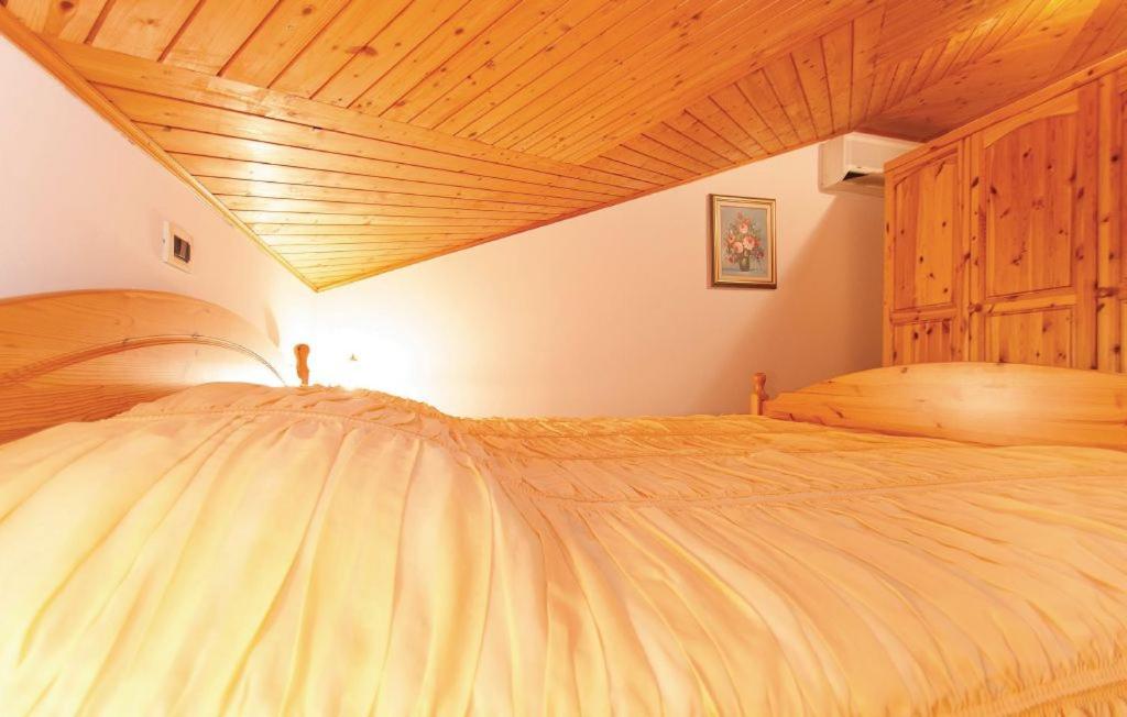 Postel nebo postele na pokoji v ubytování Apartman Pokrajac Twin