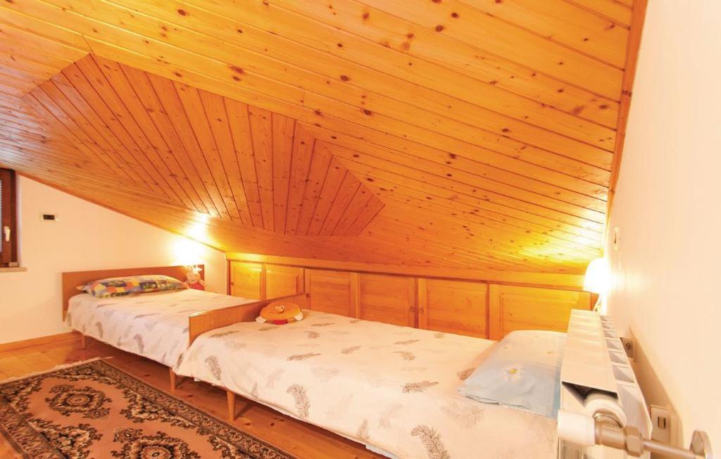 Postel nebo postele na pokoji v ubytování Apartman Pokrajac Twin
