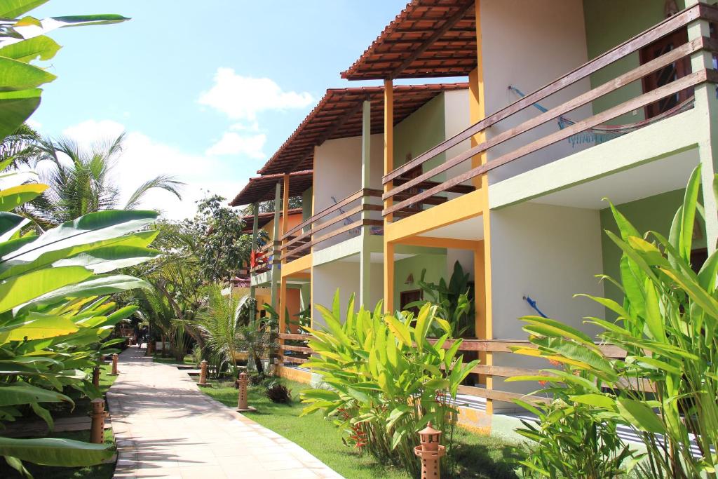 a building with a pathway in front of it at Pousada Do Rio Barreirinhas in Barreirinhas