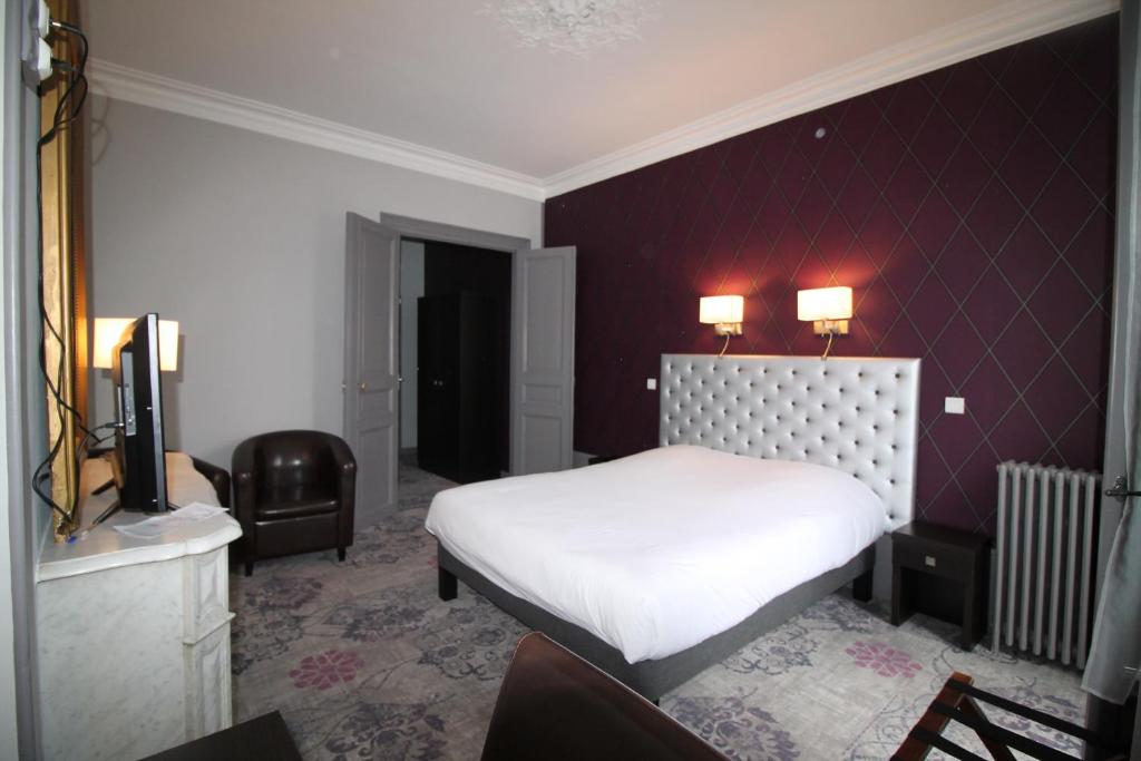 Postel nebo postele na pokoji v ubytování Hotel Le Jacquemart
