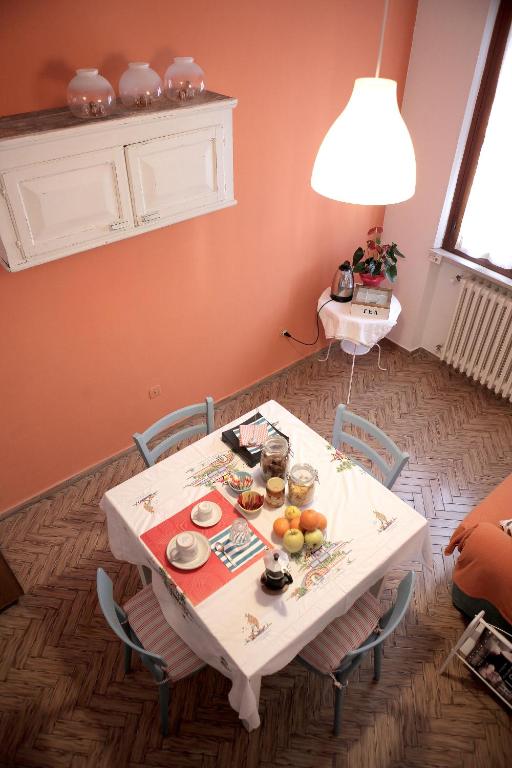 a table and chairs in a living room at Goga&Romeo in Pesaro