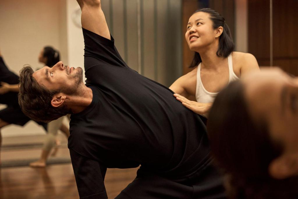 A close-up of guests participating in a mirrored movement class.