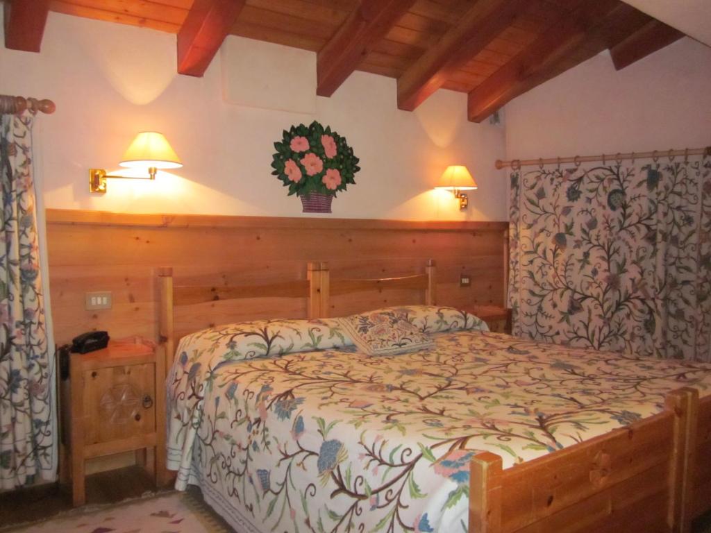 Postel nebo postele na pokoji v ubytování Hotel Mignon