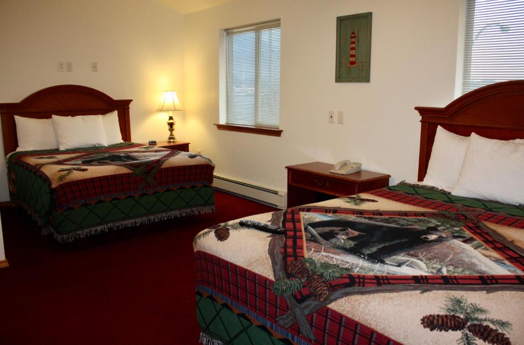 Postel nebo postele na pokoji v ubytování Juneau Hotel