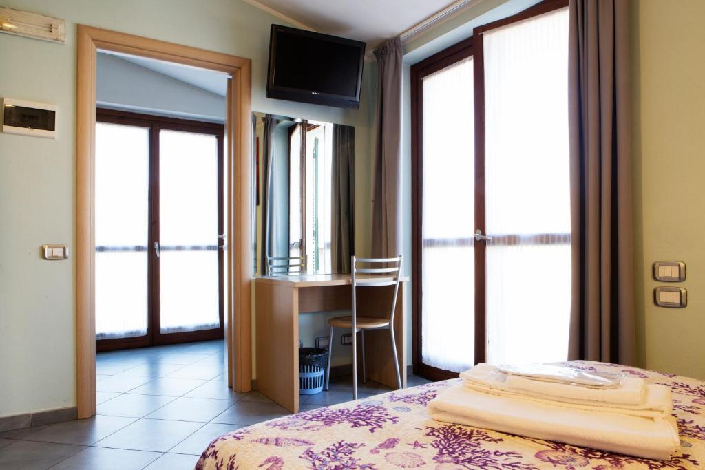 Posteľ alebo postele v izbe v ubytovaní Albergo Verdi