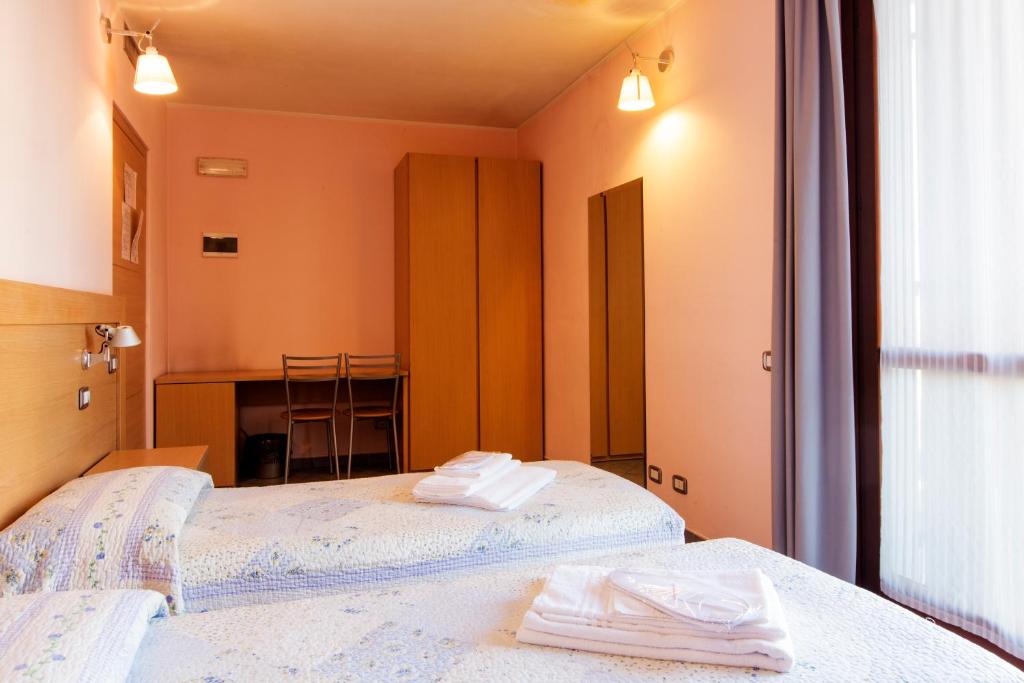 Posteľ alebo postele v izbe v ubytovaní Albergo Verdi