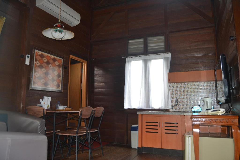 Kuchyň nebo kuchyňský kout v ubytování Citra Cikopo Hotel & Family Cottages