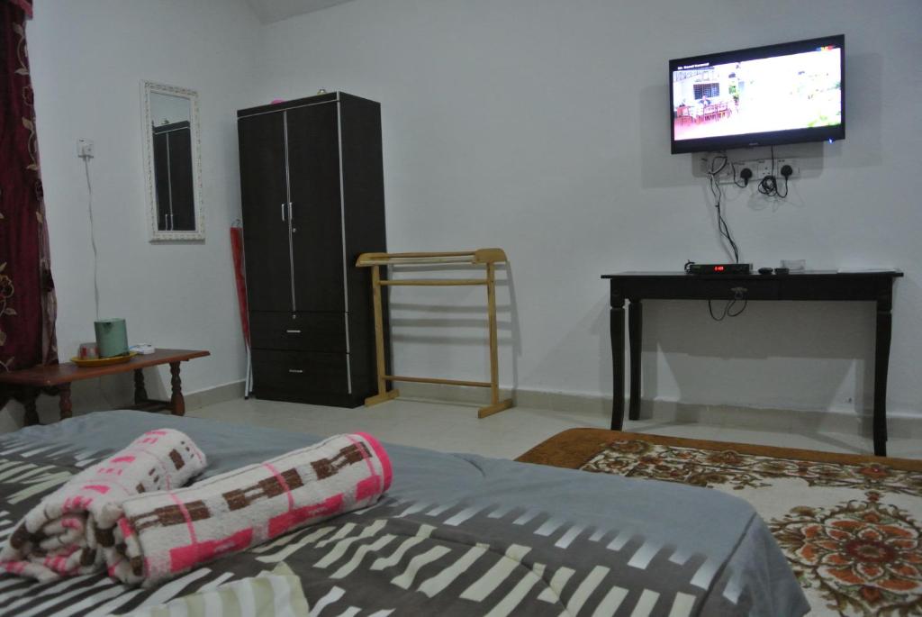 Postel nebo postele na pokoji v ubytování Wave Langkawi Inn