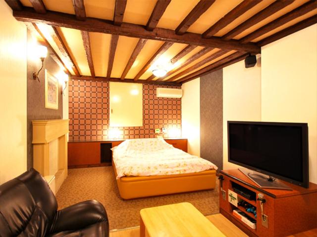TV a/nebo společenská místnost v ubytování Hotel.COM (Adult Only)