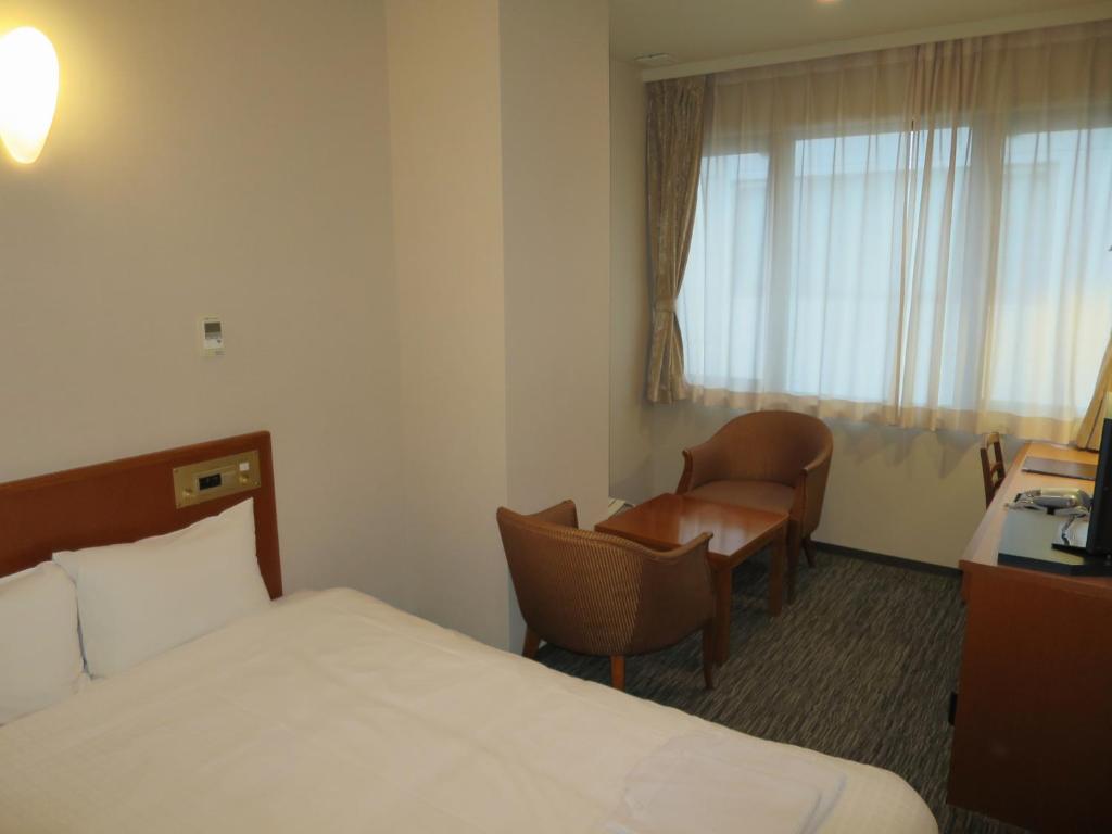Postel nebo postele na pokoji v ubytování Sun Palace Hotel