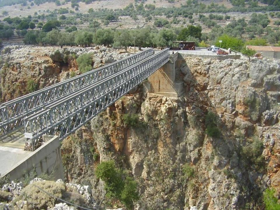 a bridge on the side of a mountain at Platanos Rooms in Anopoli Sfakion