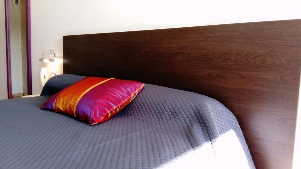 Postel nebo postele na pokoji v ubytování Hôtel Résidence Bergara