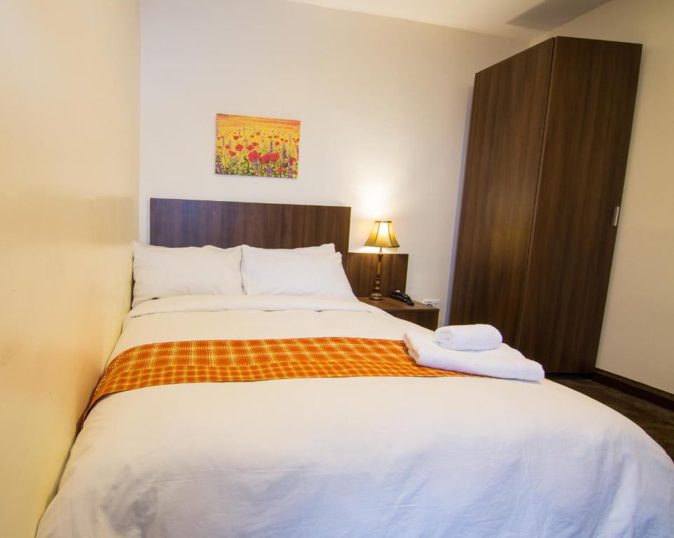 Postel nebo postele na pokoji v ubytování Sinclair Guest House