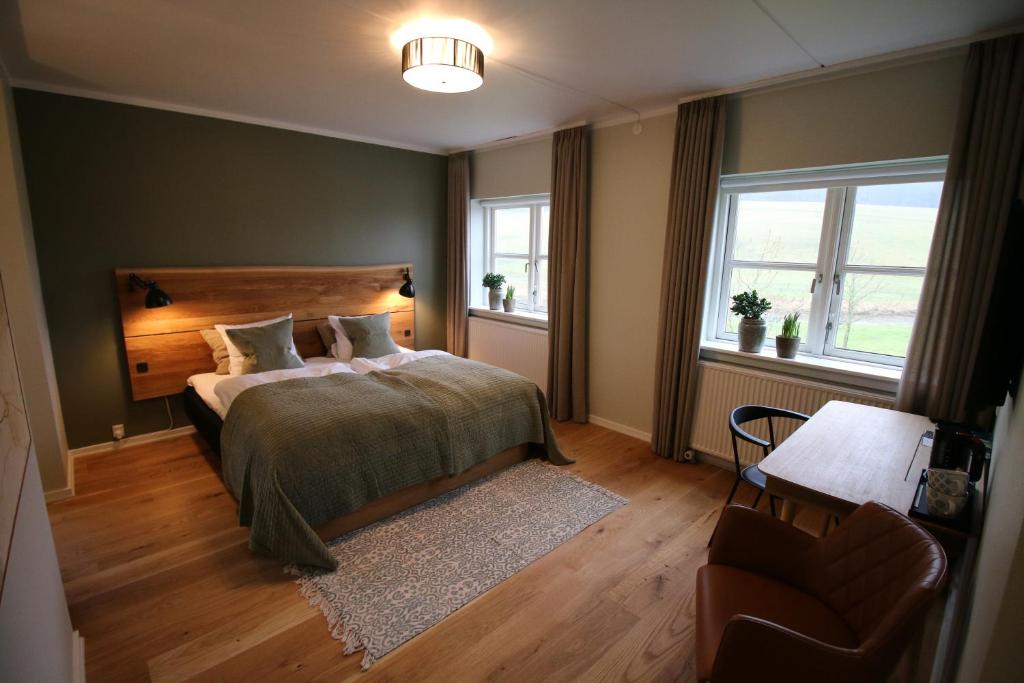 Postel nebo postele na pokoji v ubytování Haraldskær Sinatur Hotel & Konference