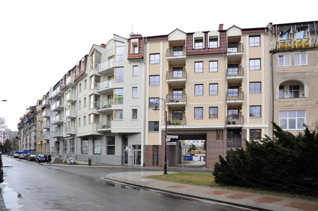 a large apartment building on a city street at Dream Apartment in Świnoujście