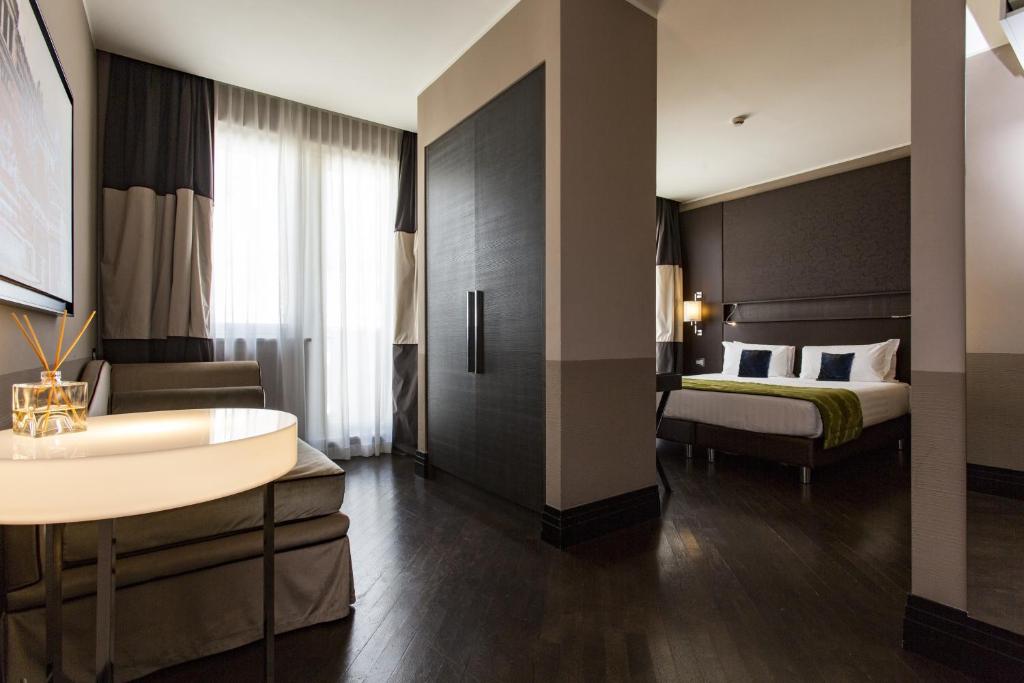 Postel nebo postele na pokoji v ubytování Rome Times Hotel